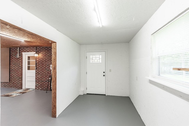 154 Church Ave, Watertown, TN 37184 - entrance foyer with finished concrete floors and a textured ceiling