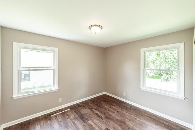 154 Church Ave, Watertown, TN 37184 - empty room featuring baseboards, visible vents, and dark wood-style floors