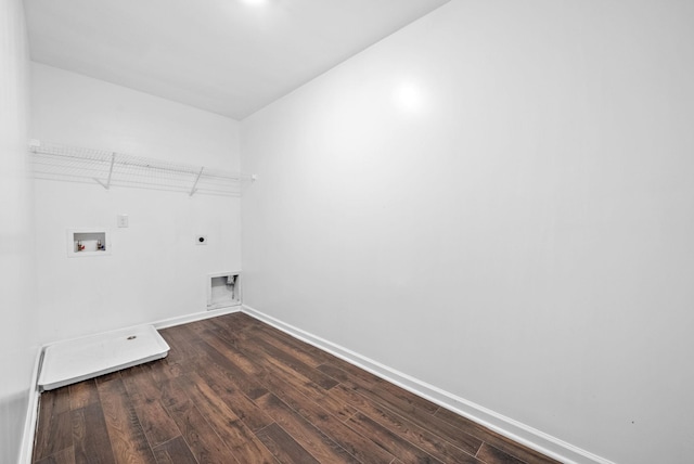 clothes washing area featuring electric dryer hookup, dark wood finished floors, baseboards, and washer hookup