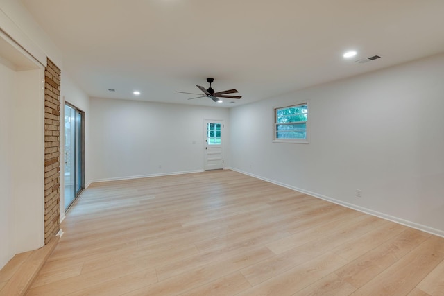 unfurnished room with a ceiling fan, baseboards, recessed lighting, light wood-type flooring, and visible vents
