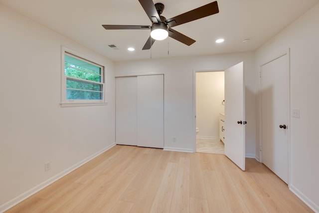 unfurnished bedroom with visible vents, ensuite bathroom, baseboards, recessed lighting, and light wood-style flooring