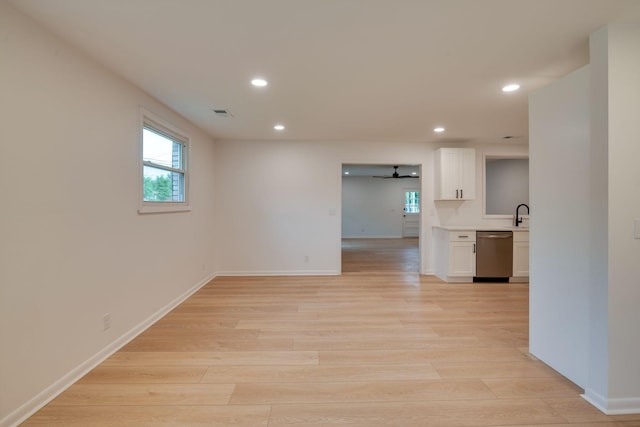 empty room featuring recessed lighting, a ceiling fan, and light wood-style floors