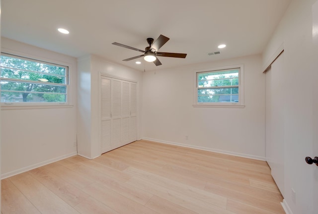 unfurnished bedroom with recessed lighting, baseboards, visible vents, and light wood-type flooring