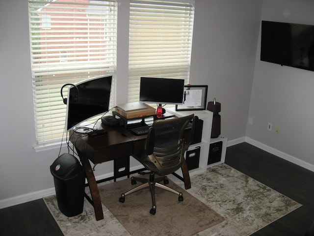 office area featuring baseboards and wood finished floors