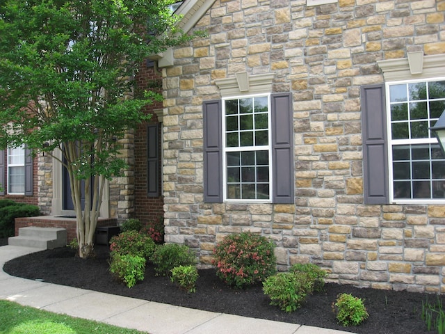 view of home's exterior featuring stone siding