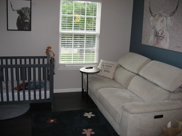 bedroom featuring wood finished floors and baseboards