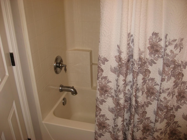 bathroom featuring shower / bath combo with shower curtain