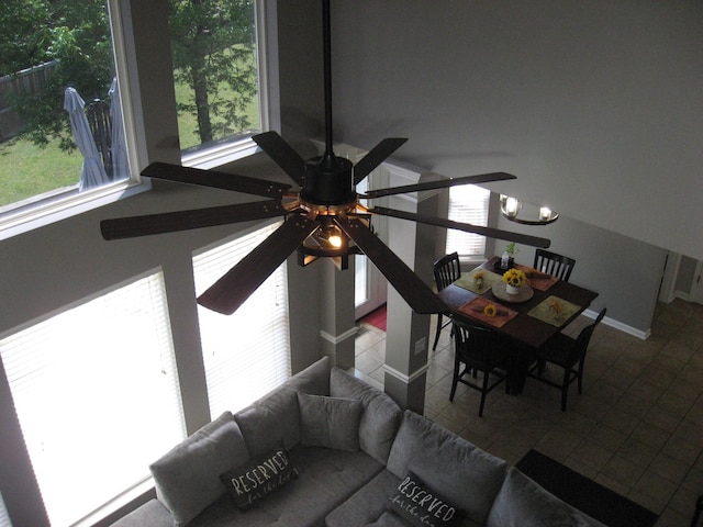 interior space featuring tile patterned flooring and ceiling fan