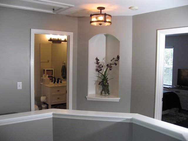 hall featuring a sink