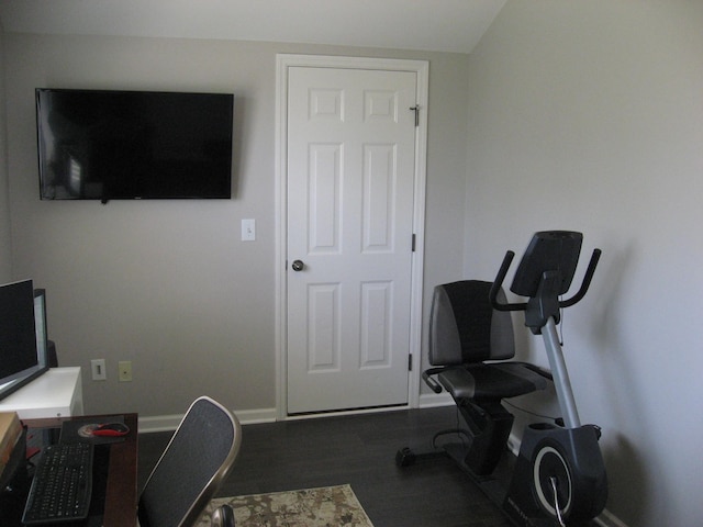 office space with baseboards and wood finished floors