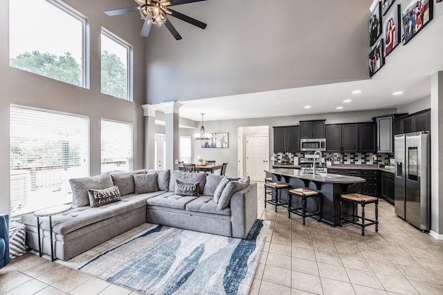 1505 Sylvan Park Ct, Mount Juliet, TN 37122 - living area featuring a towering ceiling, ceiling fan, a chandelier, light tile patterned floors, and recessed lighting