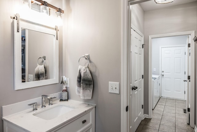 1505 Sylvan Park Ct, Mount Juliet, TN 37122 - bathroom with washer and clothes dryer, tile patterned flooring, and vanity