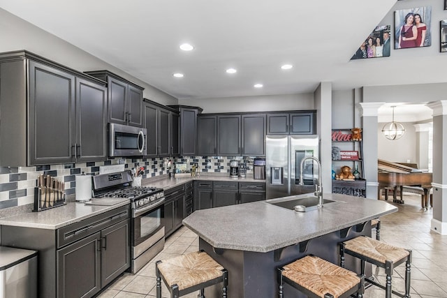 1505 Sylvan Park Ct, Mount Juliet, TN 37122 - kitchen featuring appliances with stainless steel finishes, light tile patterned flooring, backsplash, recessed lighting, and a sink