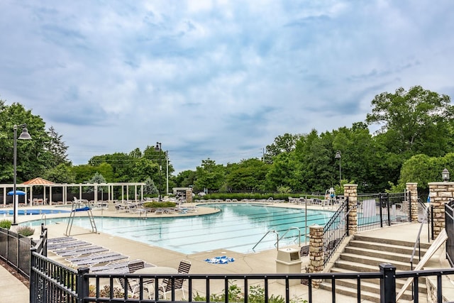 1505 Sylvan Park Ct, Mount Juliet, TN 37122 - community pool featuring fence, view of wooded area, and a patio area