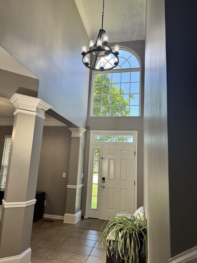 1505 Sylvan Park Ct, Mount Juliet, TN 37122 - tiled entryway with a high ceiling, ornate columns, a chandelier, ornamental molding, and baseboards