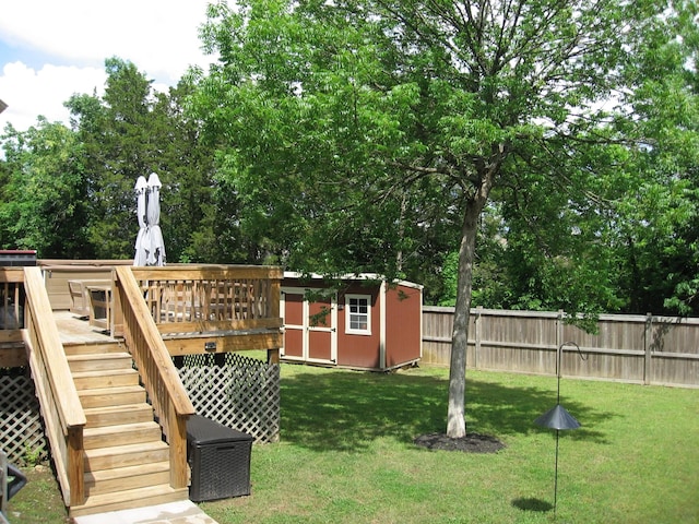 1505 Sylvan Park Ct, Mount Juliet, TN 37122 - view of yard with a deck, a storage unit, stairs, an outdoor structure, and view of wooded area