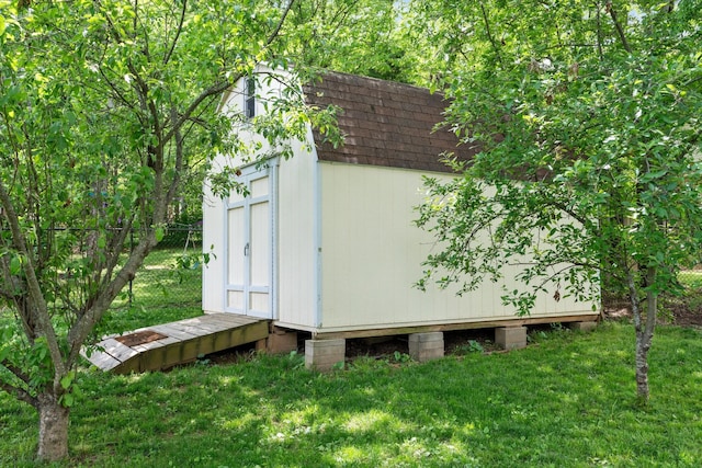 view of shed with fence