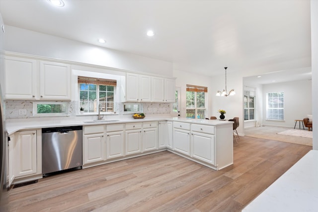 1069 Fitzpatrick Rd, Nashville, TN 37214 - kitchen with stainless steel dishwasher, a sink, a chandelier, light countertops, and recessed lighting