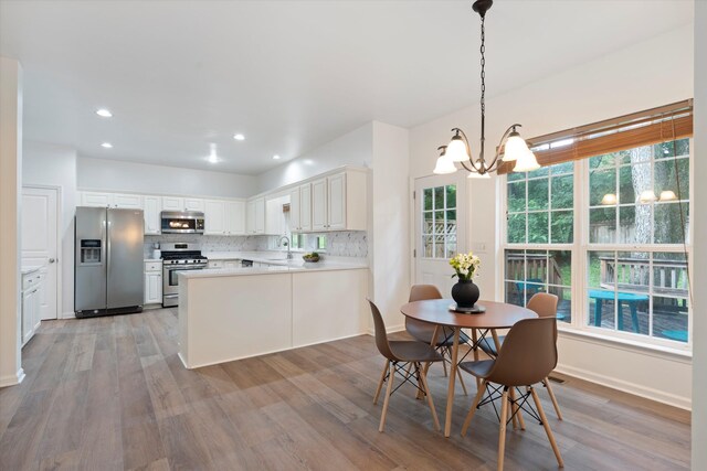 1069 Fitzpatrick Rd, Nashville, TN 37214 - dining area featuring a chandelier, light wood finished floors, plenty of natural light, recessed lighting, and baseboards