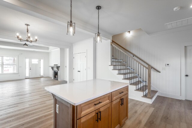 492 Willow Grove Ct Unit 60, Ringgold, GA 30736 - kitchen with brown cabinetry, light wood finished floors, open floor plan, and visible vents