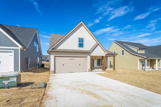 492 Willow Grove Ct Unit 60, Ringgold, GA 30736 - traditional-style house featuring an attached garage, covered porch, and concrete driveway