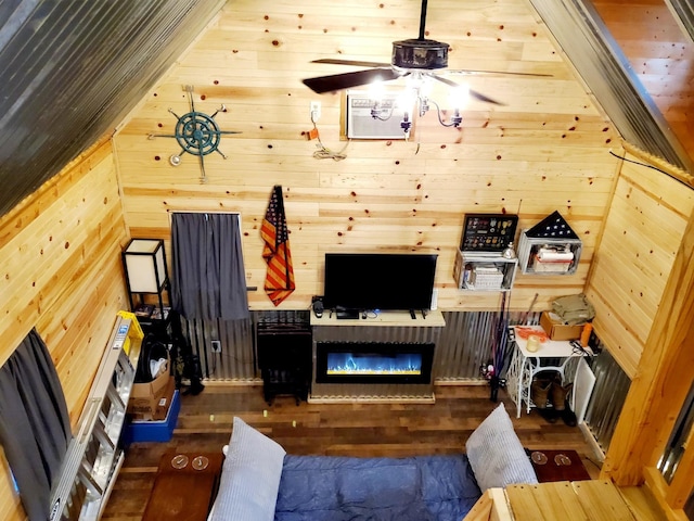 4179 Beaver Bend Dr, Nunnelly, TN 37137 - living room with a ceiling fan, a glass covered fireplace, wood finished floors, and wooden walls
