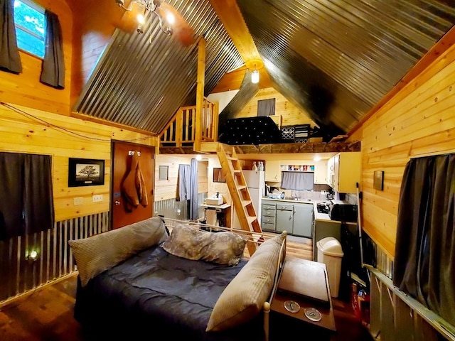 4179 Beaver Bend Dr, Nunnelly, TN 37137 - bedroom with wooden walls, high vaulted ceiling, and wood finished floors