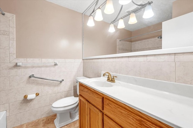 419 Westwood Dr, Tullahoma, TN 37388 - bathroom featuring toilet, tile walls, vanity, a shower, and tile patterned flooring