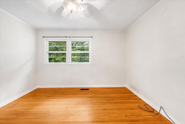 419 Westwood Dr, Tullahoma, TN 37388 - spare room with a ceiling fan, light wood finished floors, a textured ceiling, baseboards, and ornamental molding