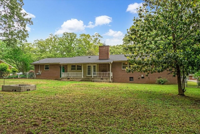 419 Westwood Dr, Tullahoma, TN 37388 - back of property with a chimney, crawl space, a vegetable garden, and brick siding
