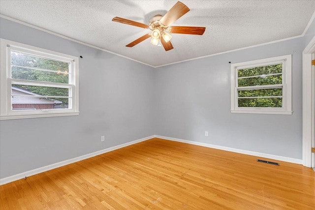 419 Westwood Dr, Tullahoma, TN 37388 - unfurnished room with light wood-style floors, ceiling fan, a textured ceiling, baseboards, and ornamental molding