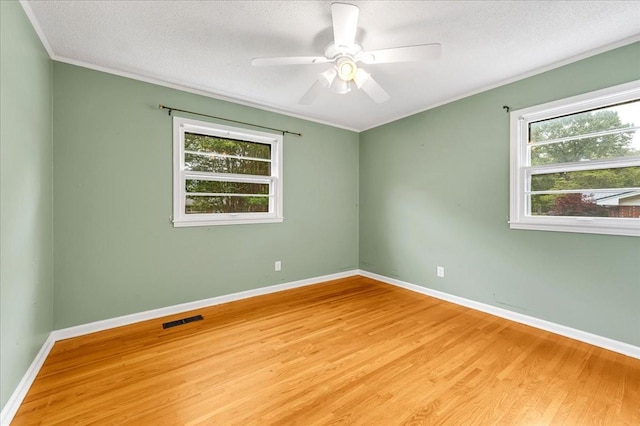 419 Westwood Dr, Tullahoma, TN 37388 - unfurnished room featuring light wood finished floors, a textured ceiling, baseboards, ceiling fan, and crown molding