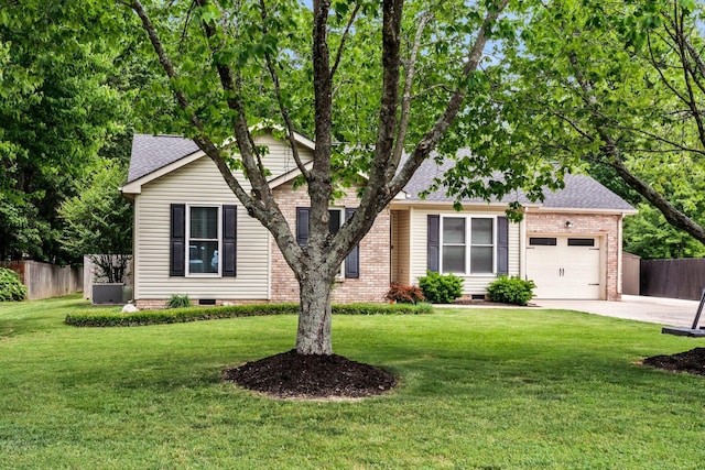 view of front of property featuring an attached garage, a front lawn, fence, and concrete driveway