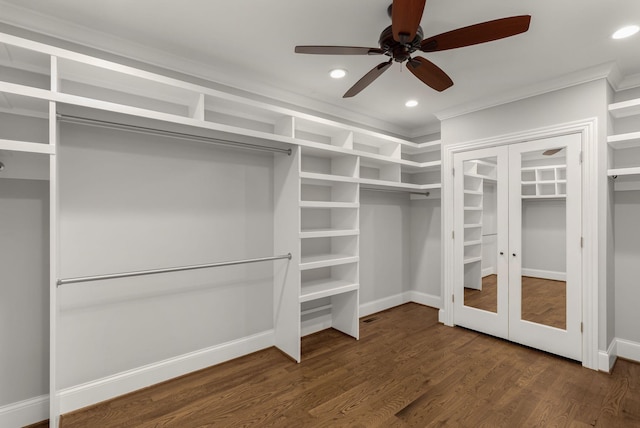 walk in closet featuring a ceiling fan and dark wood-style floors