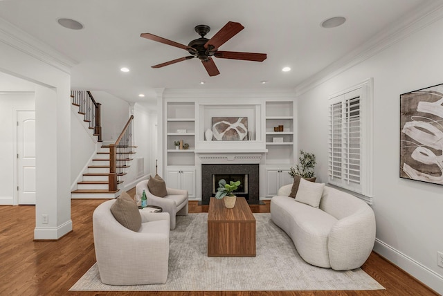 living room with stairway, baseboards, recessed lighting, and wood finished floors