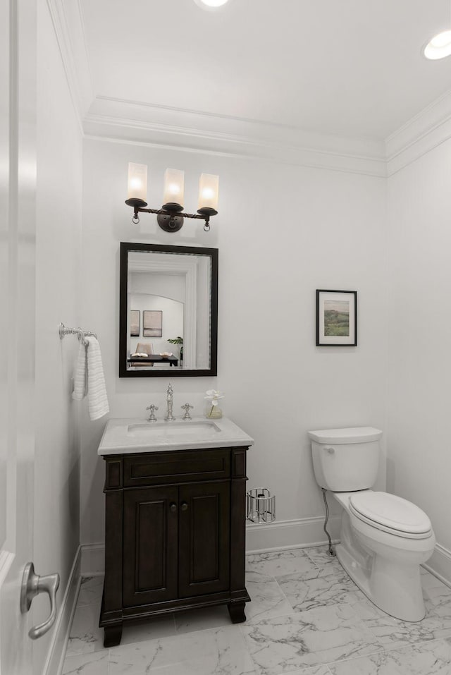 half bath featuring baseboards, ornamental molding, and marble finish floor