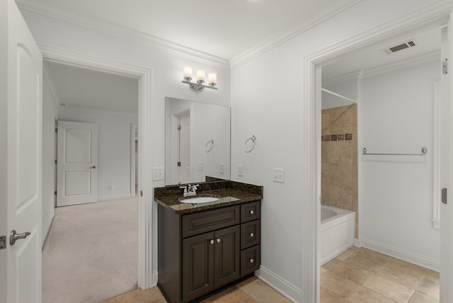 bathroom featuring bathtub / shower combination, vanity, baseboards, visible vents, and ornamental molding