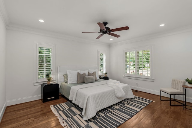 bedroom with baseboards, ornamental molding, recessed lighting, and wood finished floors