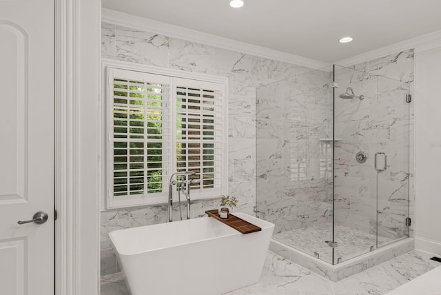 full bathroom featuring crown molding, marble finish floor, a freestanding bath, and a marble finish shower