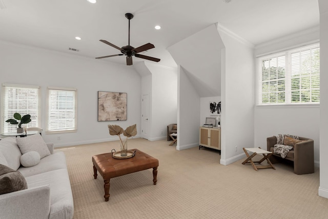 living area with crown molding, light colored carpet, a ceiling fan, and visible vents