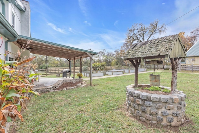 view of yard with fence and a patio