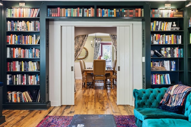 503 Brick Church Pike, Goodlettsville, TN 37072 - living area featuring wood finished floors, arched walkways, and a notable chandelier