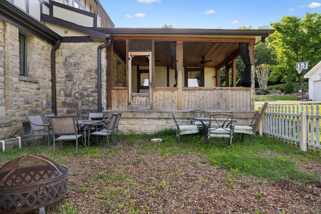 503 Brick Church Pike, Goodlettsville, TN 37072 - rear view of property with an outdoor fire pit, fence, and stone siding