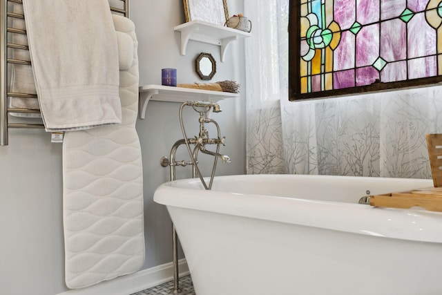 503 Brick Church Pike, Goodlettsville, TN 37072 - bathroom featuring baseboards and a freestanding tub