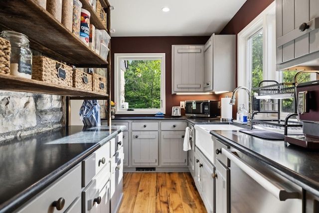 503 Brick Church Pike, Goodlettsville, TN 37072 - kitchen featuring open shelves, dark countertops, plenty of natural light, and appliances with stainless steel finishes