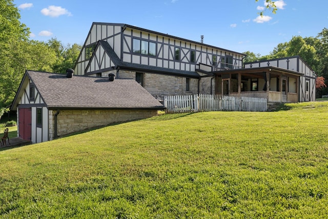 503 Brick Church Pike, Goodlettsville, TN 37072 - rear view of property featuring a yard, stone siding, roof with shingles, and fence