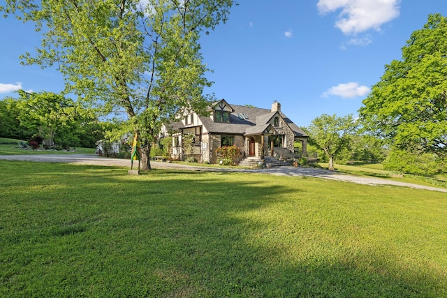 503 Brick Church Pike, Goodlettsville, TN 37072 - tudor-style house featuring stone siding, a chimney, and a front yard