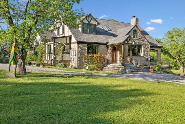 503 Brick Church Pike, Goodlettsville, TN 37072 - english style home with roof with shingles, stone siding, a chimney, and a front yard