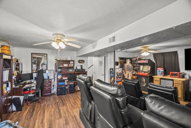 interior space featuring stairs, wood finished floors, a textured ceiling, visible vents, and a ceiling fan