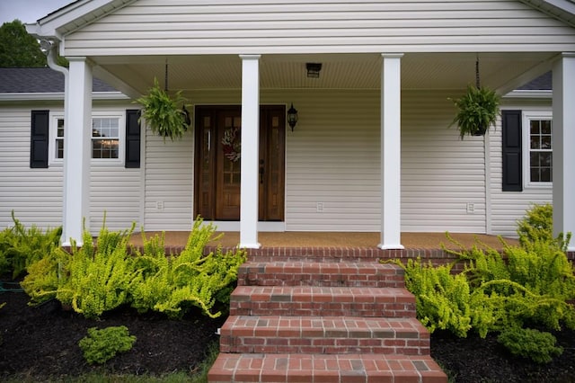 entrance to property with covered porch